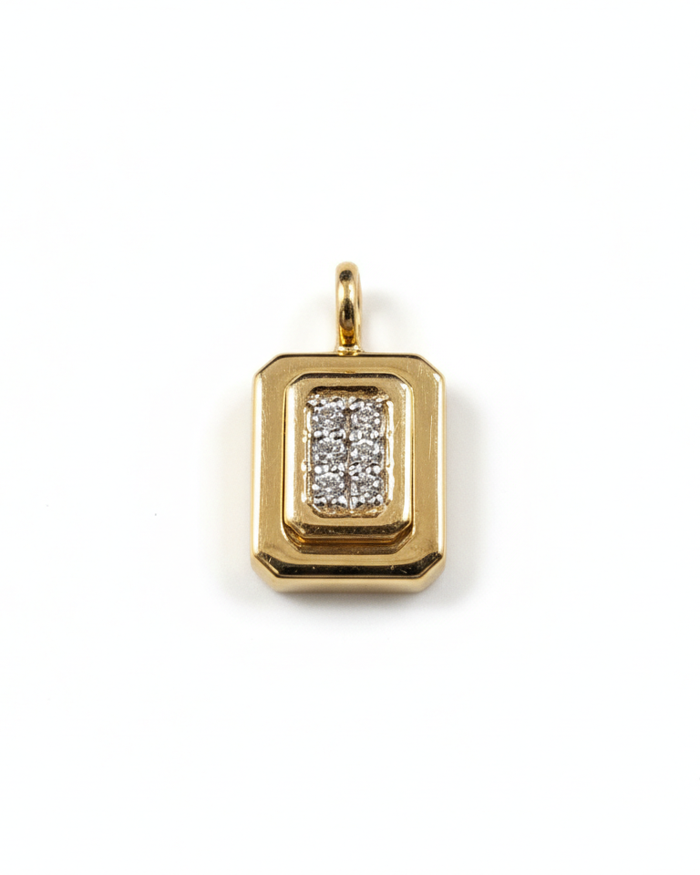 Gold pendant on a white background